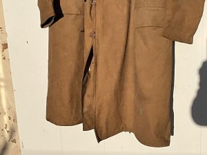 Made by m. Shorn & sons and dated 1943. Introduced in 1940 for the ill fated landings in norway. Production carried on into the first part of wwii seeing action with the long range desert group amongst other units. This is the earlier sheepskin lined coat,  was later replaced by the quilted kapok lined version. In between the outer khaki canvas and the sheepskin is a waterproof interlining which is very good, note the metal clip buttons a very quirky way of fastening ones coat. Coat though a little dirty is in solid no tears complete condition has two small moth holes on the collar see pictures, size 3 to fit breast over jacket 40 45