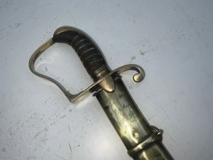 British light sabre of the late 18th century, this sword was presented to a british officer  the inscription's on the hilt of the scabbard states capt a morris to lt l r gibbs 1799, overall conditions quite good blades a little tarnish but will clean up great, length of 90 cm height 14 cm depth 3 cm,