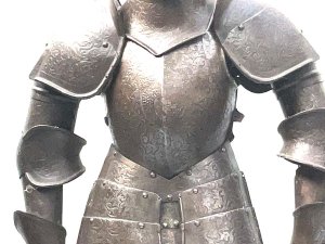 An impressive early 19th half sized suit of armour in the 16th century style, the helmet is adjustable, the suit of armour has detailed engraving throughout and includes coat of arms on the armour, supported on a moulded edge wooden plinth base, all in great condition and standing 97 cm high width 40 cm depth 22 cm circa 1820. Tel: we accept online payments for all our items listed: bank transfer cash on collection or if wishing over the phone using your debit or credit cards, also doing layby payments plan, or email giving your address details & contact number and we shall send you your items invoice to make