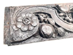 Carved english country floral and nuts possibly acorn or hazel nut in english oak still very hard and firm and no signs of infestation, length of 135 cm width 19 cm depth 3 cm,