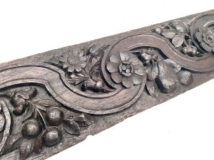 Carved english country floral and nuts possibly acorn or hazel nut in english oak still very hard and firm and no signs of infestation, length of 135 cm width 19 cm depth 3 cm,