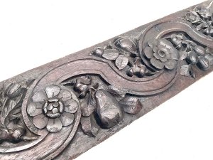Carved english country floral and nuts possibly acorn or hazel nut in english oak still very hard and firm and no signs of infestation, length of 135 cm width 19 cm depth 3 cm,