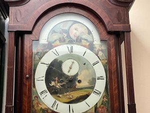 Quality clock in good working order, flame mahogany cased with inlays some of which needs replacing as missing, circa 1760's having an eight day duration, the movements in very good working condion, painted dial moon which needs some touching in and ship 24 hours rotates, the clock stands 235cm width at widest 85cm depth at deepest 30cm,