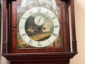 Quality clock in good working order, flame mahogany cased with inlays some of which needs replacing as missing, circa 1760's having an eight day duration, the movements in very good working condion, painted dial moon which needs some touching in and ship 24 hours rotates, the clock stands 235cm width at widest 85cm depth at deepest 30cm,