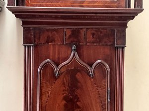 Quality clock in good working order, flame mahogany cased with inlays some of which needs replacing as missing, circa 1760's having an eight day duration, the movements in very good working condion, painted dial moon which needs some touching in and ship 24 hours rotates, the clock stands 235cm width at widest 85cm depth at deepest 30cm,