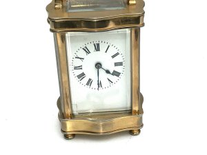 Clock comes in good working order all sections of glass are very good porcelain dial has small damage bottom left corner facing, height to top of extended handle 16cm width 8cm depth being 7cm, reference sb