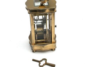 Clock comes in good working order all sections of glass are very good porcelain dial has small damage bottom left corner facing, height to top of extended handle 16cm width 8cm depth being 7cm, reference sb