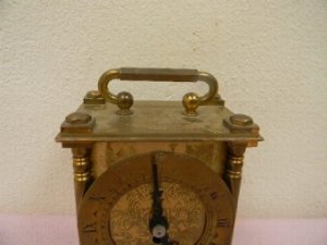 In good working order brass work good nicely engraved has a quality 8 day mechanical movement manufactured by Smiths clocks of England sizes are height 10cm length 9cm depth 6.5cm