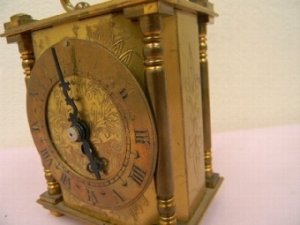 In good working order brass work good nicely engraved has a quality 8 day mechanical movement manufactured by Smiths clocks of England sizes are height 10cm length 9cm depth 6.5cm