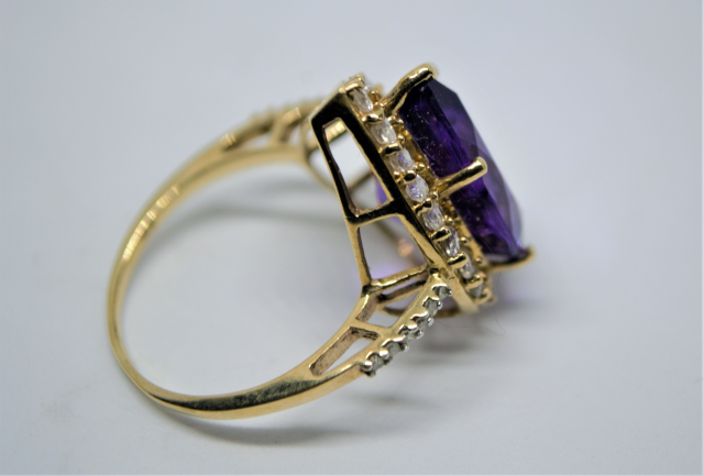 A 9ct Gold With Large Pear Cut Amethyst And CZ Ring.