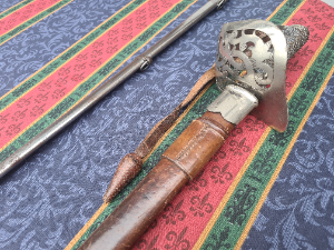 Explore an authentic piece of history with our 1892 pattern 64th Indian Pioneers Infantry Sword inclusive of its original dress, field leather scabbard, and sword bag. A timeless treasure with minor signs of age; more photos available on request.