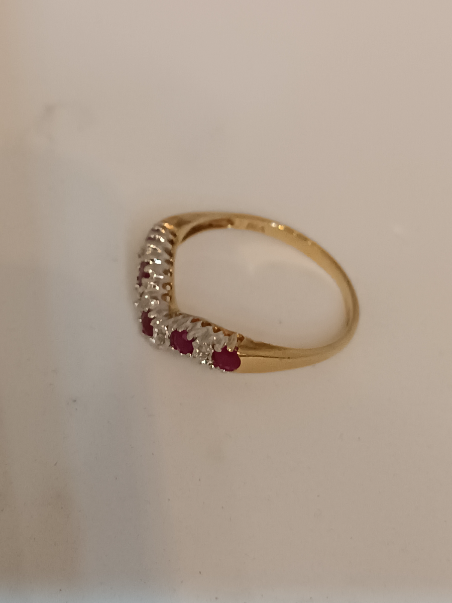 Explore our 9ct gold half eternity ring, adorned with rubies and diamonds. Symbolizing passion, love, and authenticity. Order now!