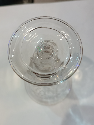 Discover our exclusive Mid 18th c folded foot wine glass with a detailed grape vine engraving. Perfect addition to your collection. Shop now!