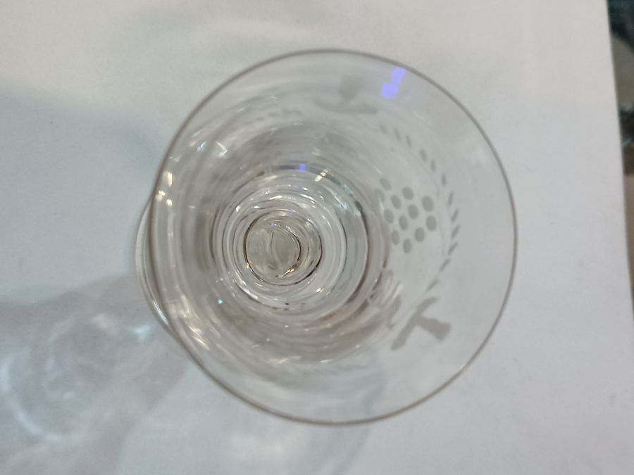 Discover our exclusive Mid 18th c folded foot wine glass with a detailed grape vine engraving. Perfect addition to your collection. Shop now!