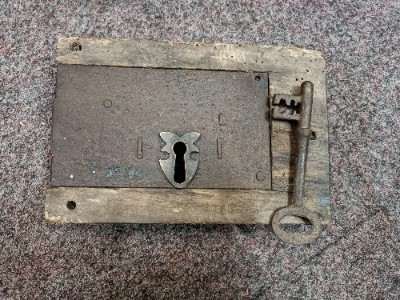 Discover our collection of 19th century iron locks. This feature includes a well-preserved lock in wooden surround with a key. Shop now online for a unique piece of history.