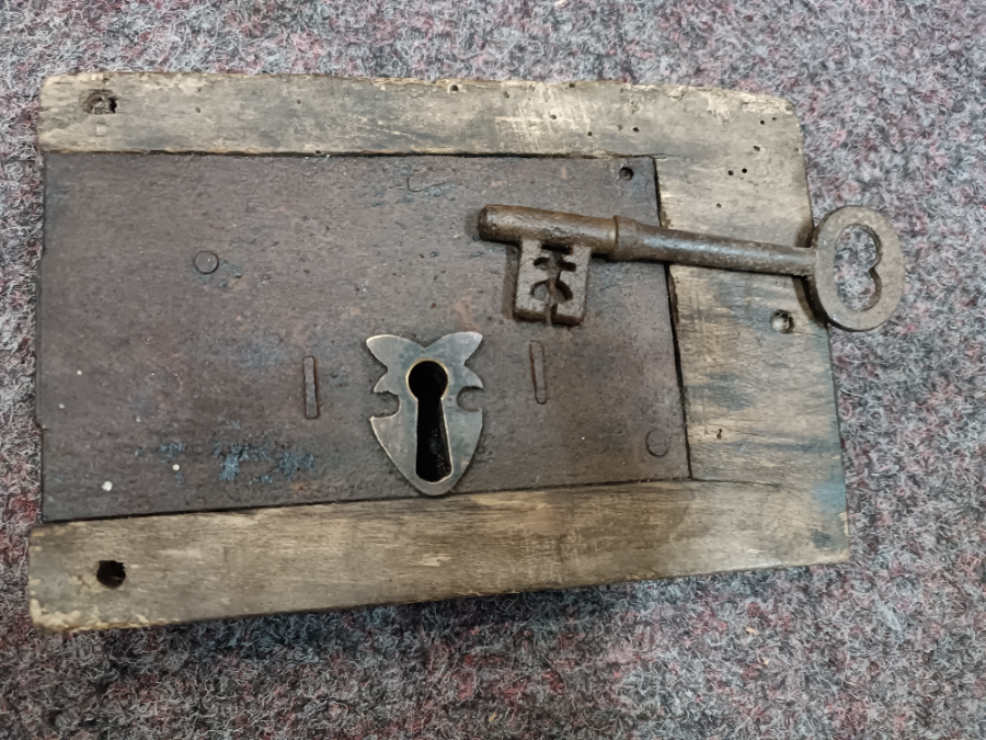 Discover our collection of 19th century iron locks. This feature includes a well-preserved lock in wooden surround with a key. Shop now online for a unique piece of history.