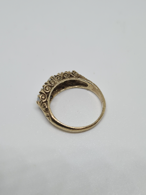 Discover our 9ct gold ring set with 5 opal stones. Featuring Birmingham hallmarks, weighing 3.3 grams, and sized N. Shop now for luxury jewelry!