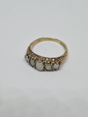 Discover our 9ct gold ring set with 5 opal stones. Featuring Birmingham hallmarks, weighing 3.3 grams, and sized N. Shop now for luxury jewelry!