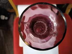 A Mary Gregory amethyst Vase with 2 handles depicting a young lady with hibiscus flowers.  Size 26 cm high.