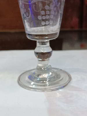 Discover our broad range of mid-18th-century wine glasses. This bucket bowl features a unique grape vine design and measures 10 cm. High. Shop now!