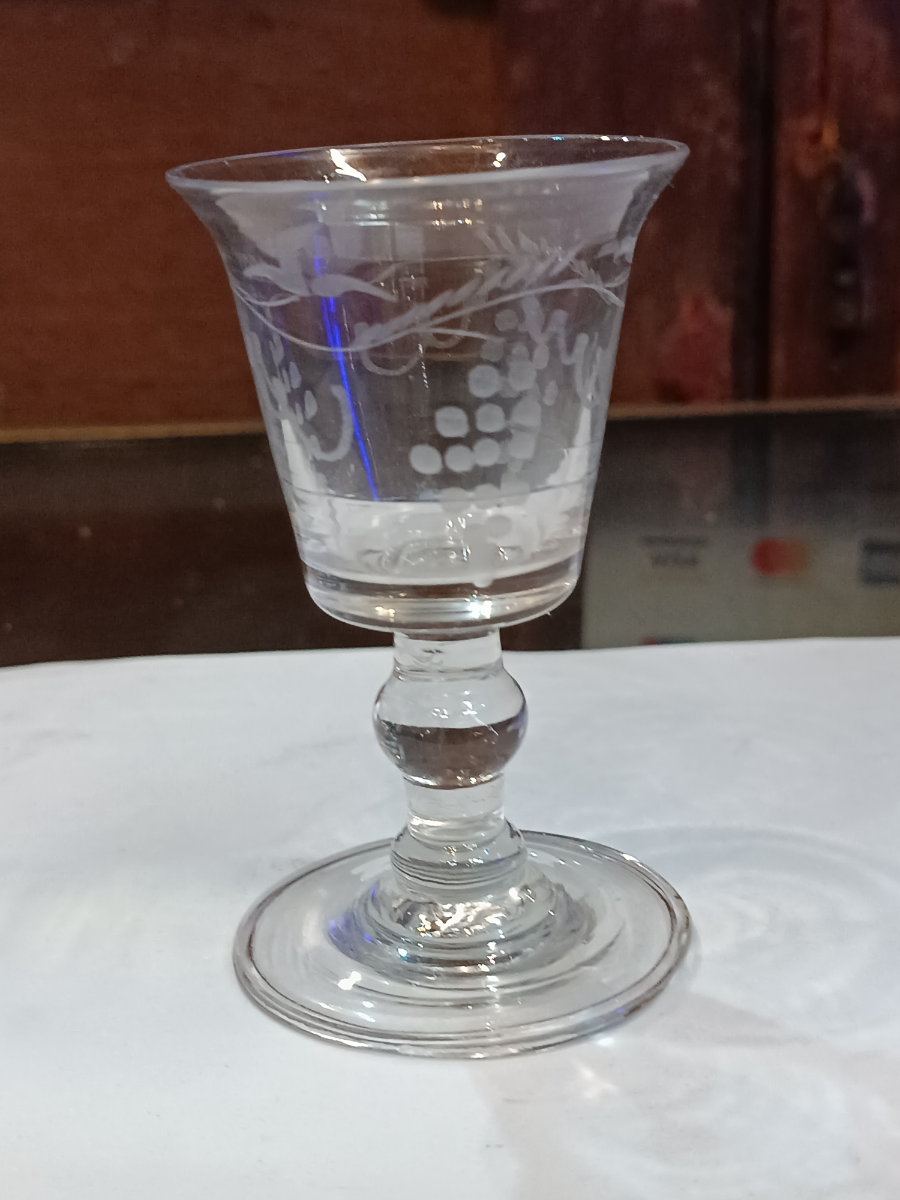 Discover our broad range of mid-18th-century wine glasses. This bucket bowl features a unique grape vine design and measures 10 cm. High. Shop now!