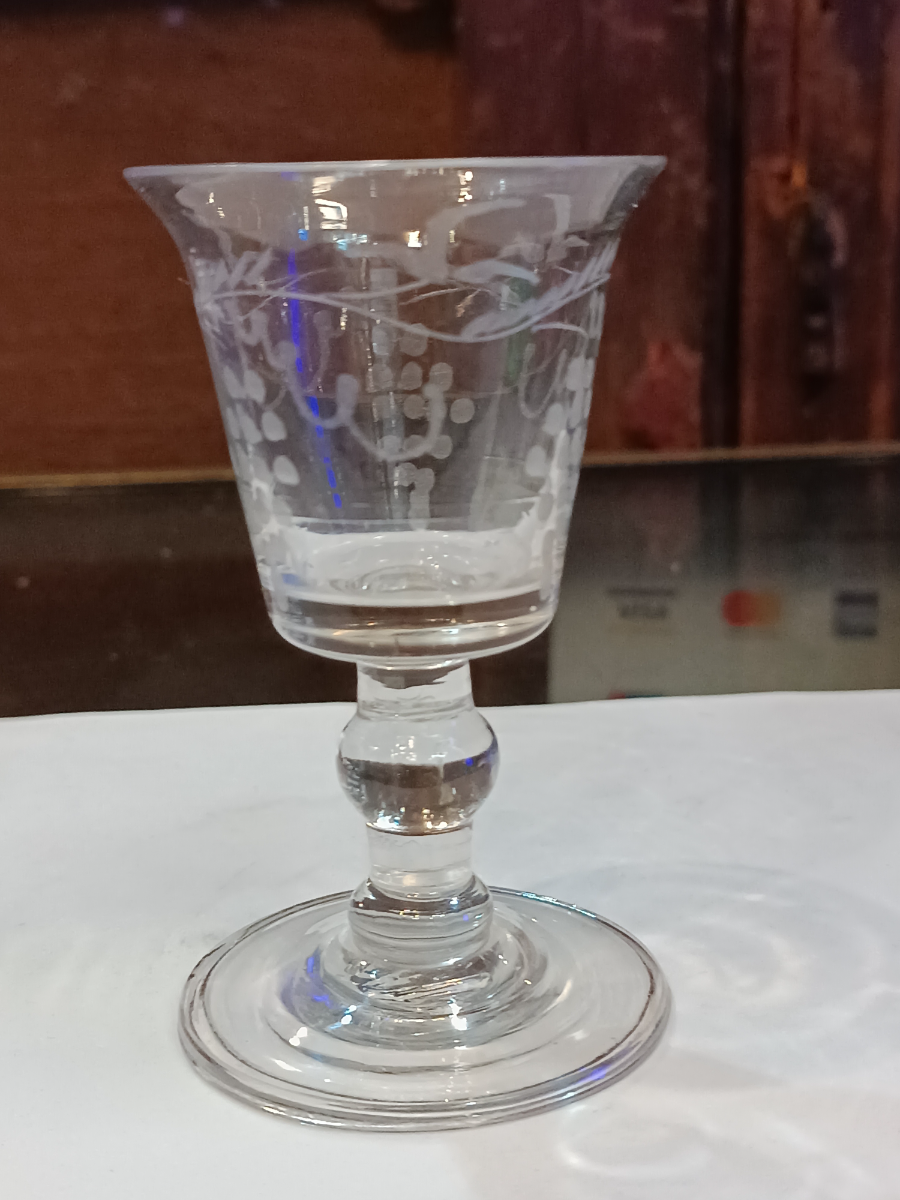 Discover our broad range of mid-18th-century wine glasses. This bucket bowl features a unique grape vine design and measures 10 cm. High. Shop now!