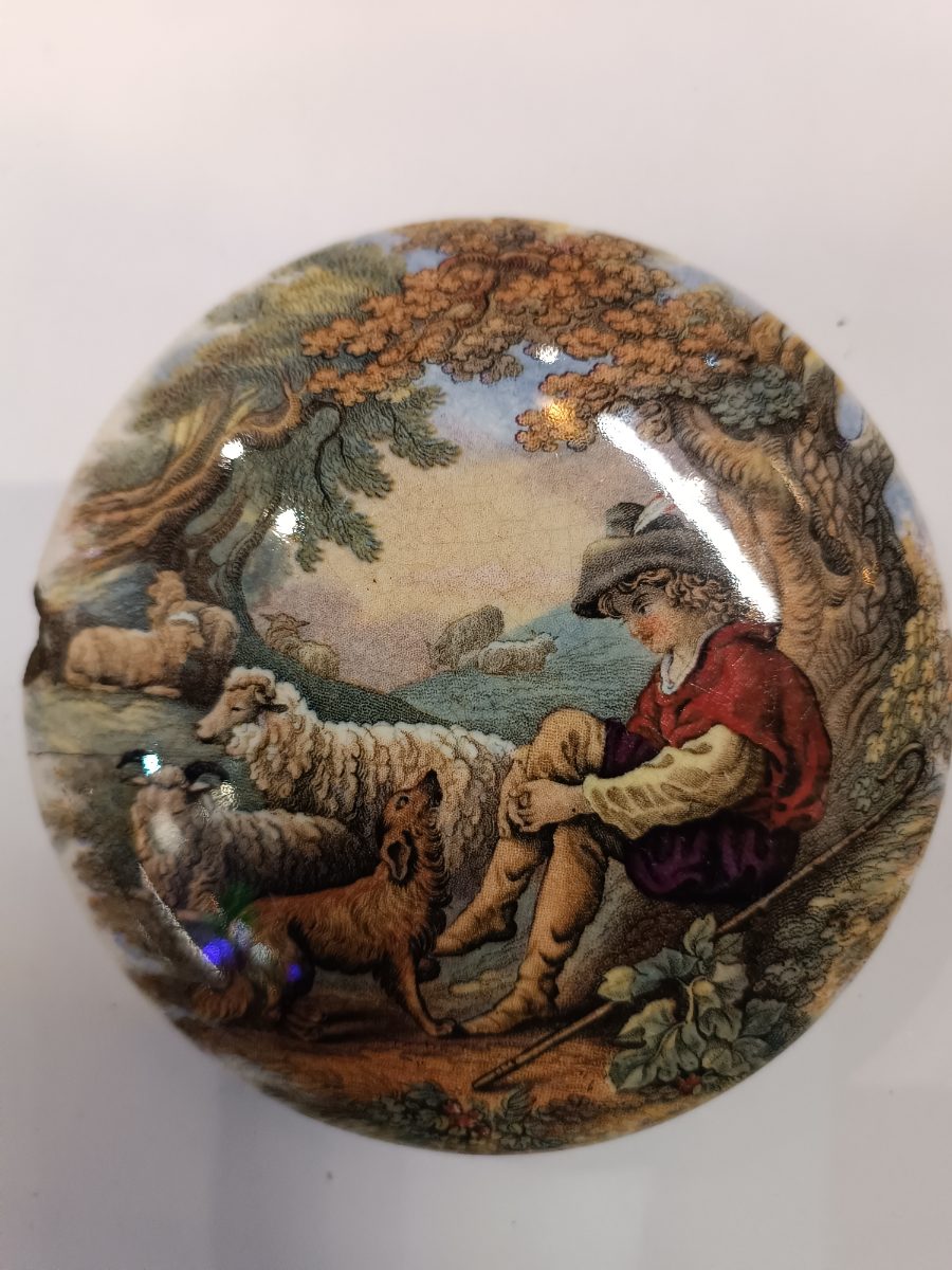 Discover our collection of 19th c Prattware Pot lids, featuring elegant depictions of shepherds and sheep. Explore unique antique lid designs now!