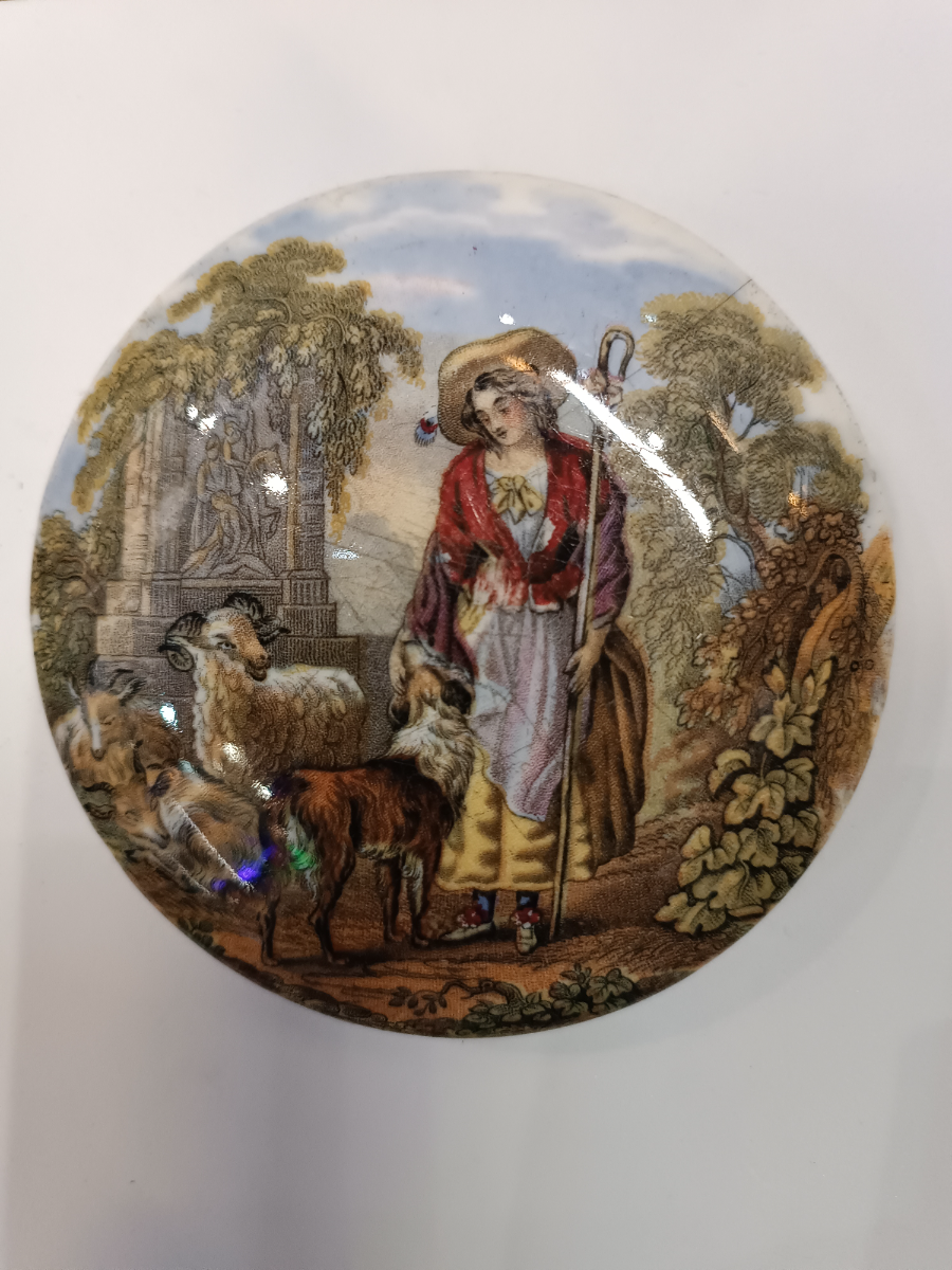 Discover our collection of 19th c Prattware Pot lids, featuring elegant depictions of shepherds and sheep. Explore unique antique lid designs now!