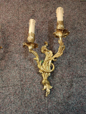 A Set Of Three Rococo Style Gilt Double Wall Lights With Candle Effect Sconces