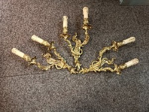 A Set Of Three Rococo Style Gilt Double Wall Lights With Candle Effect Sconces