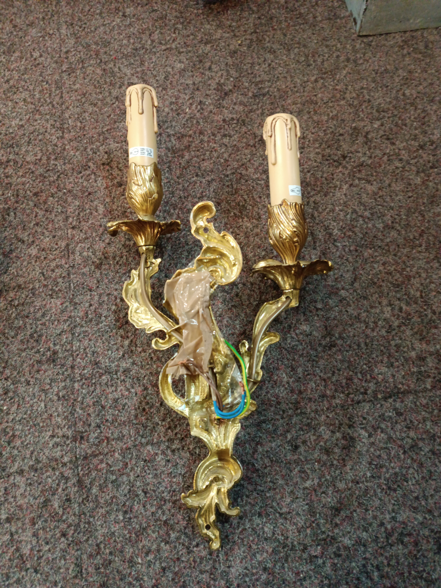 A Set Of Three Rococo Style Gilt Double Wall Lights With Candle Effect Sconces