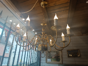 A Solid Brass Eight Branch Ceiling Chandelier