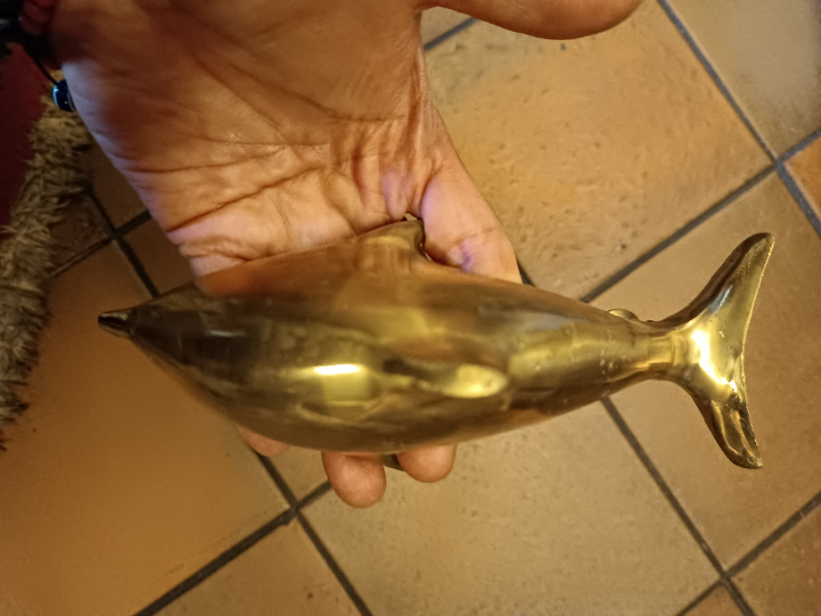 A Solid Dolphin Shaped Brass Door Knocker Completed With Bolt Fittings.