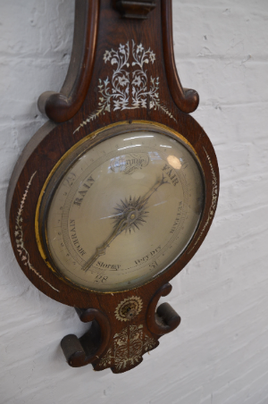A Victorian Rosewood And Mother Of Pearl Inlaid Wheel Barometer