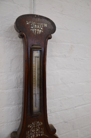 A Victorian Rosewood And Mother Of Pearl Inlaid Wheel Barometer