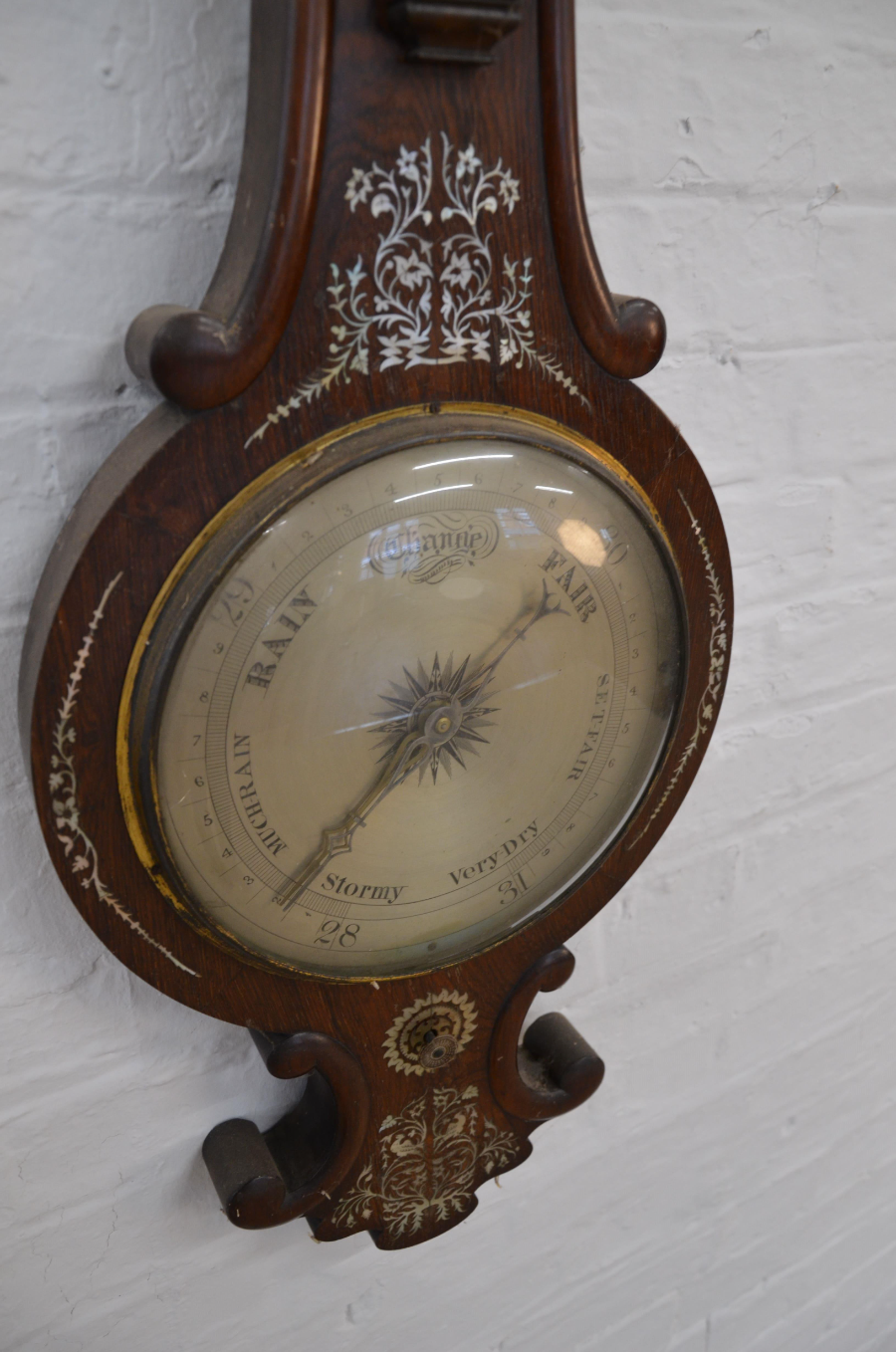 A Victorian Rosewood And Mother Of Pearl Inlaid Wheel Barometer