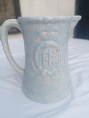 An Arthur Wood Commemorative relief jug, king Edward VIII.  In good condition.  Size 19 cm high.