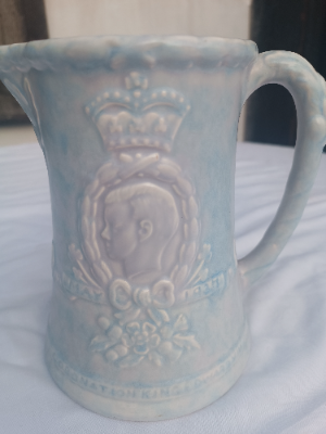 An Arthur Wood Commemorative relief jug, king Edward VIII.  In good condition.  Size 19 cm high.