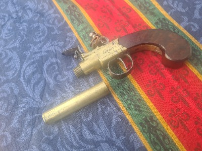Explore our collection of English Flintlock pocket pistols by Archer. Uncover the beauty of a 68 bore, 3-inch brass barrel. Buy now for a unique piece of history!