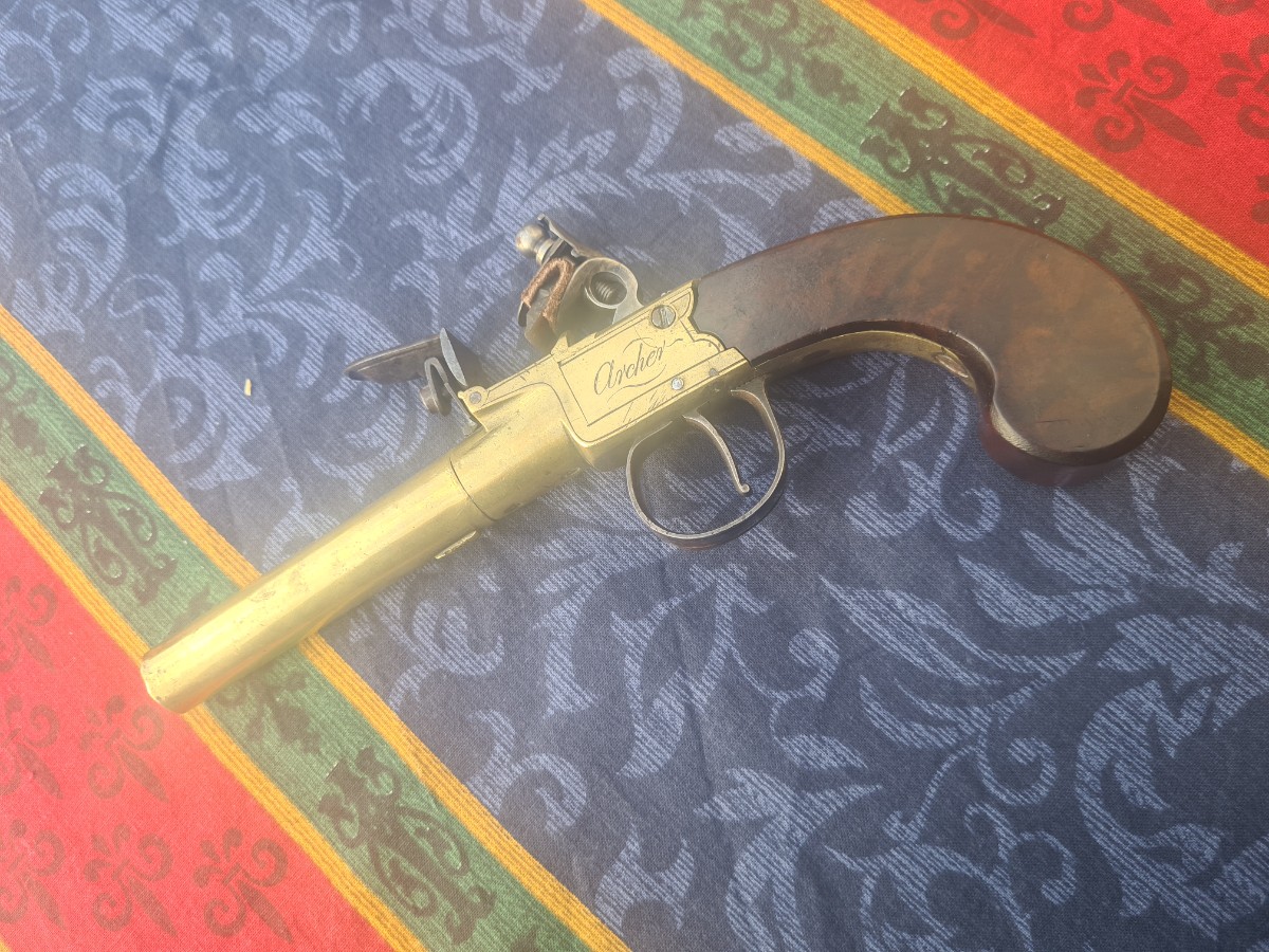 Explore our collection of English Flintlock pocket pistols by Archer. Uncover the beauty of a 68 bore, 3-inch brass barrel. Buy now for a unique piece of history!