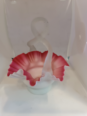 Discover our stunning Victorian Uranium Cased Satin Milk Cranberry Glass bowl with twisted handle. Sized 13cm by 16cm. Shop now to add antique elegance to your décor!