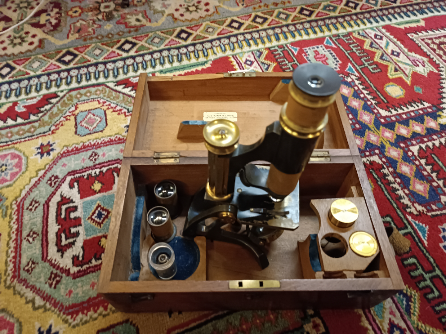 Discover our late 19th-century brass microscope with a mahogany box and multiple lenses. Supplied by Clarksons, it's a collector's gem. Shop now!