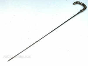 Rosewood with silver inlaid crooked handle with the name of BRIGG engraved at silvers rim dated 1874, good high tension steel blade in tarnished but very good condition all in good condition, total length of 89 cm length across crooks handle is 12 cm, stick diameter from handle 2 cm tapering down to the ferrule being 1.5 cm, from steel tip to top of the handle 82 cm, offering free delivery UK reference AC24.m  Tel: +44 7505 165 843 We accept online payments for all our items listed: Bank transfer cash on collection  or if wishing over the phone using your debit or credit cards, also doing layby payments plan, or email giving your address details & contact number and we shall send you your items invoice to make payment with your card. Send your request to - john.strong2@gmail.com