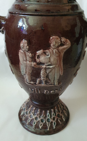 Explore our range of antique pottery! Grab the beautifully crafted Puzzle Jug by Edward Bingham from Castle Hedingham Pottery in Essex. Sign up and avail our special offers now!