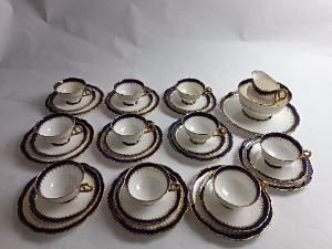 Discover our 33-piece Coalport Spearpoint Tea Service Set, an elegant early 20th century masterpiece. Add a touch of whimsy to your tea time. Shop now and embrace tradition!