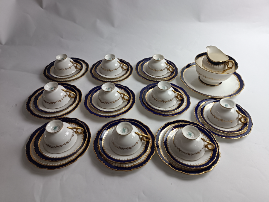 Discover our 33-piece Coalport Spearpoint Tea Service Set, an elegant early 20th century masterpiece. Add a touch of whimsy to your tea time. Shop now and embrace tradition!