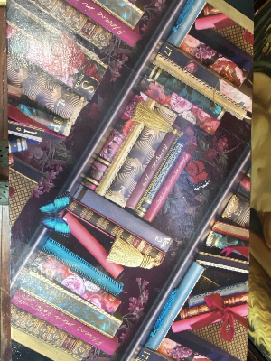 Contemporary Library Montage Hall Table With Bamboo X Frame Stretcher

Circa - Vintage 
Composition - SoftWood Top With Bamboo Stand

Beautiful Rectangular Hall Table With Brightly Coloured Bespoke Library Book Montage Decorative Top In Fuchsia, Cobalt Blue, Red & Gold. An Elegant Oriental Style Base In Gilt Bamboo With X Frame Stretcher Support.

Stunning Showpiece For Eclectic Interior An Eye Catching Ornamental Display.

Dimensions In Inches

Height 29"
Width 30" 
Depth 18" 
Weight Approx 15 KG