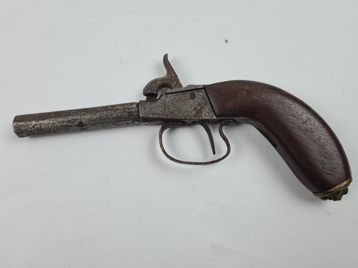 Discover our rare continental percussion pistol, adorned with a unique brass lion head. Likely Belgian-made. Act now, explore our vintage firearms collection!