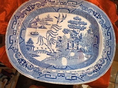 Discover our 19th century Blue Willow pattern meat platter with a unique 'well and tree' design. Shop now for this functional and charming piece of history.