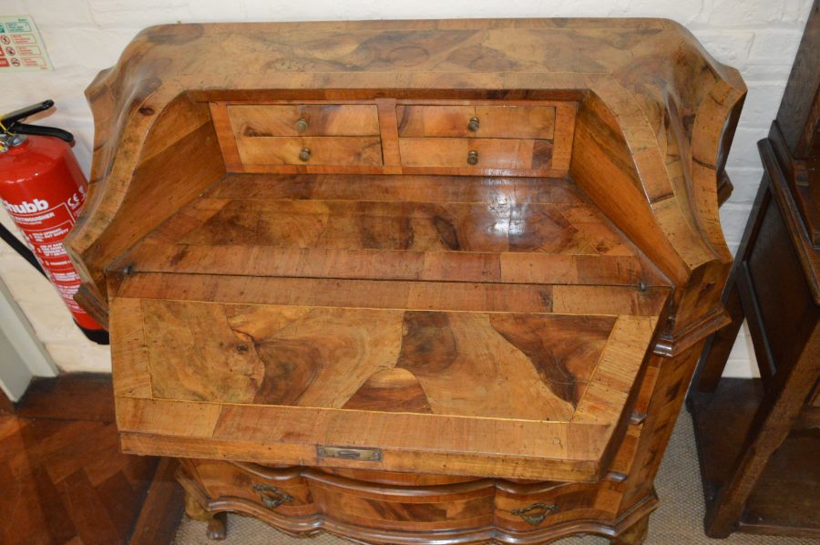 Discover our collection of 19th-century Dutch walnut bureaus. Features like delicate boxwood inlay, drawers with brass handles, and original keys for authenticity await. Shop now for the perfect vintage touch!